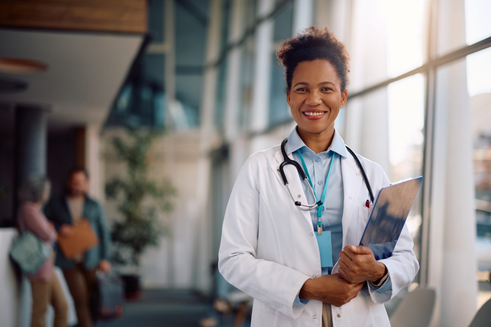 Smiling woman doctor with stethoscope